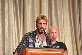 John McAfee speaking at an event 