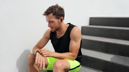 Man listening to audiobooks during exercise