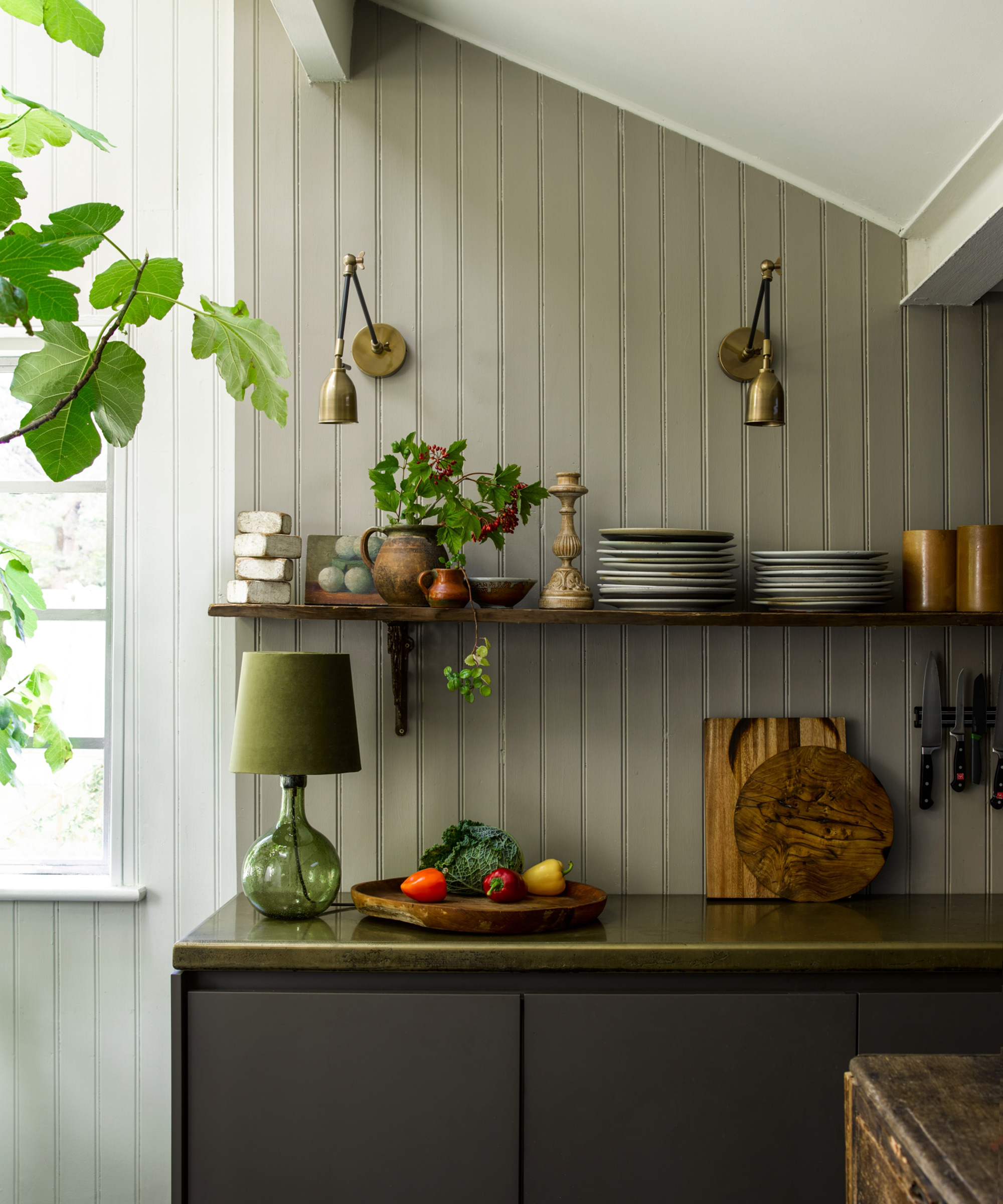 kitchen with sloping roof and wall lights