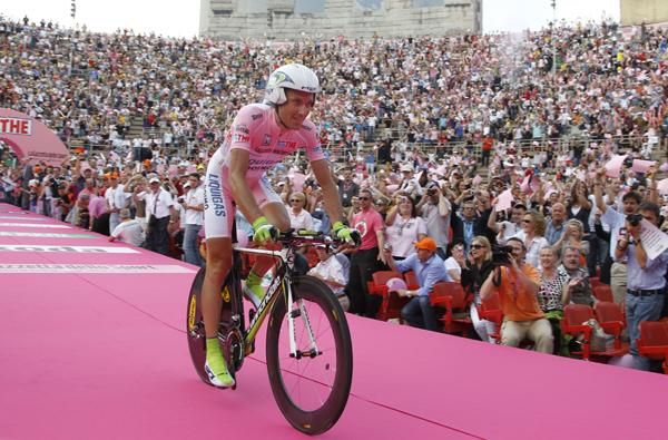 Basso makes his way to the podium after the final time trial