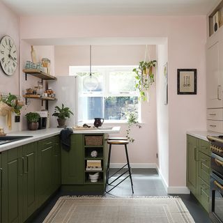 green kitchen with pink walls