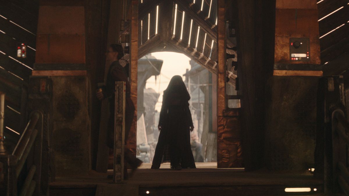 Mae (Amandla Stenberg) stands in a doorway in The Acolyte