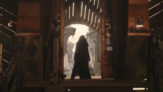 Mae (Amandla Stenberg) stands in a doorway in The Acolyte