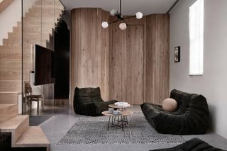 Main living room black, white and wooden decor elements in, Nido II, Melbourne house by Angelucci Architects is an urban nest