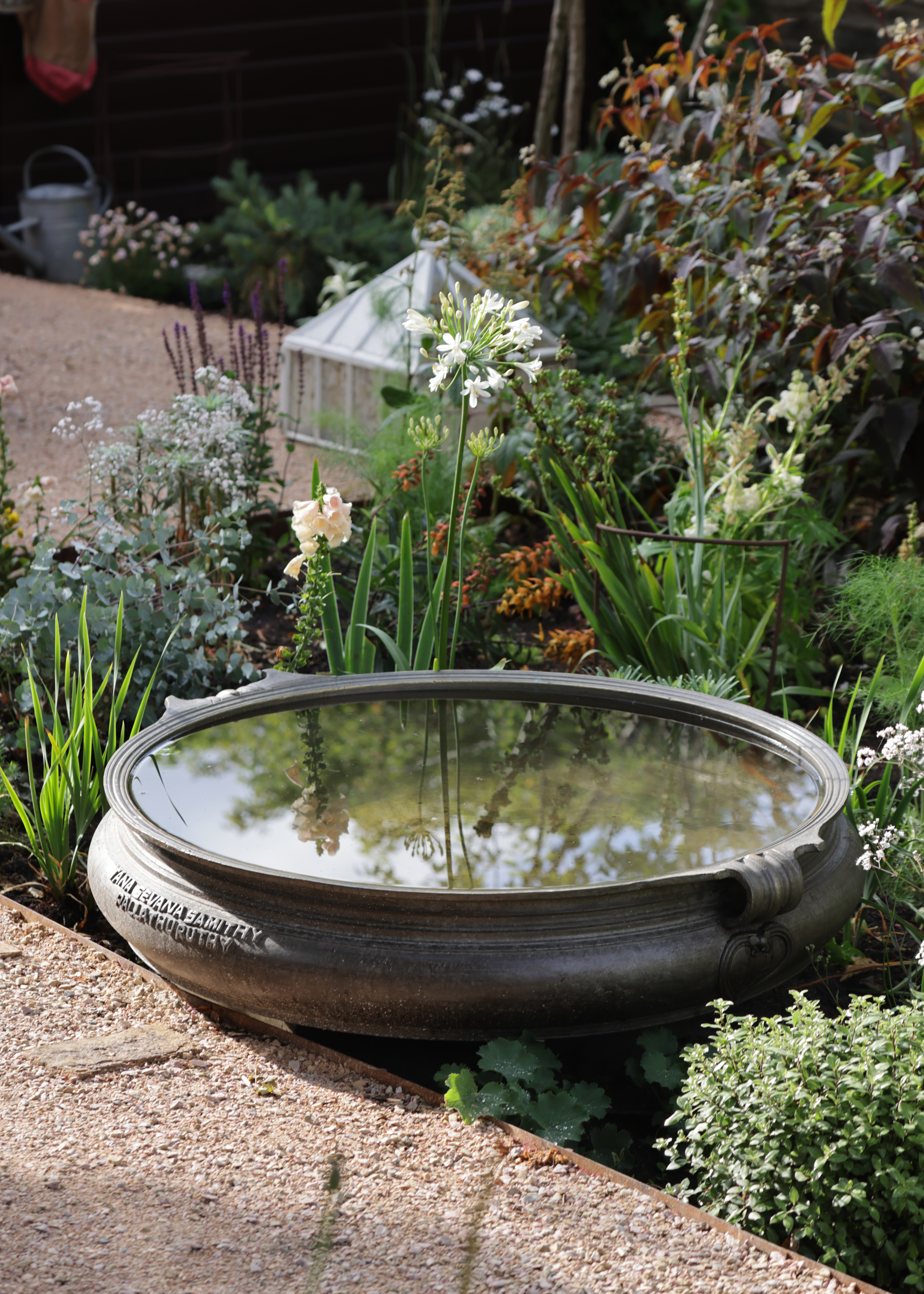 small round water feature in a garden