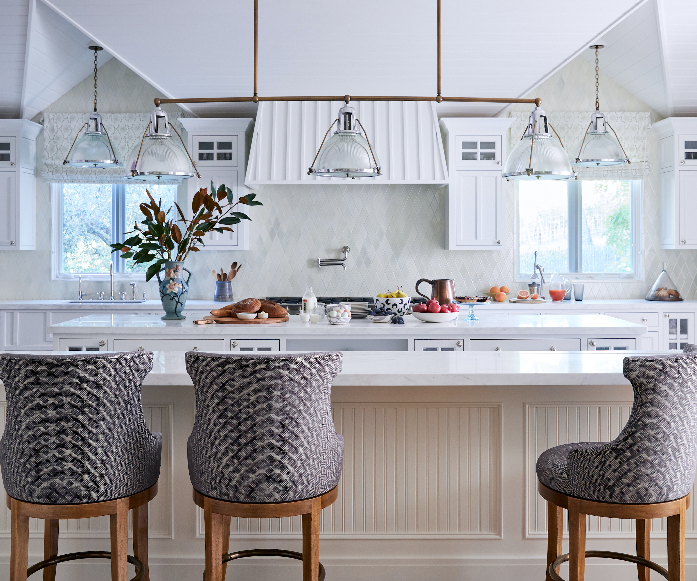white kitchen with grey stools
