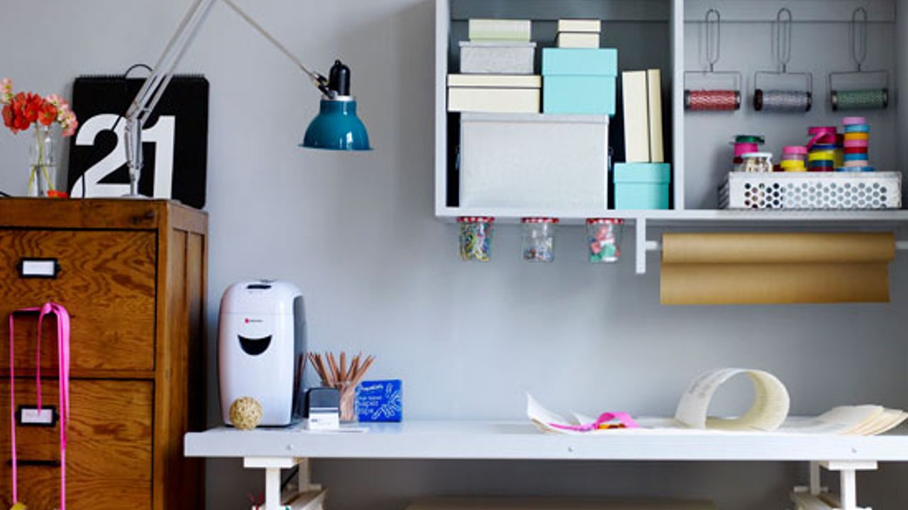 home office with blue wall and table