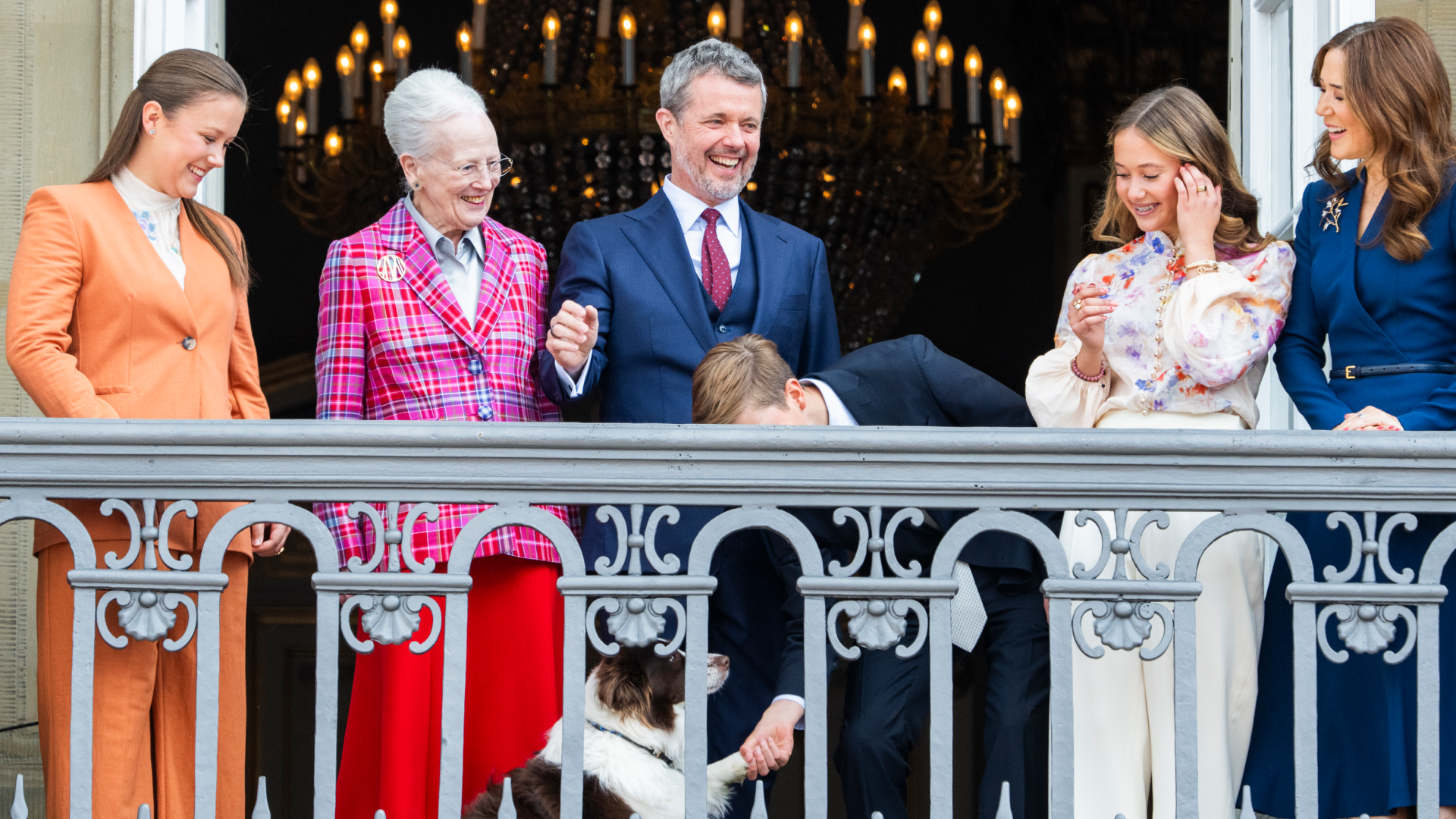 Princess Isabella of Denmark, Queen Margrethe of Denmark, King Frederik X of Denmark, Prince Vincent of Denmark, Princess Josephine of Denmark, Queen Mary of Denmark and their dog on the balcony for Frederik's birthday