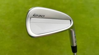 The sleek Ping i230 irons showing off their crisp and sharp clubhead