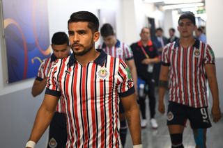 Guadalajara players in the club's retro shirt at the FIFA Club World Cup in December 2018.