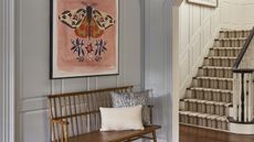 hallway with bench and butterfly print plus staircase with cool graphic pattern