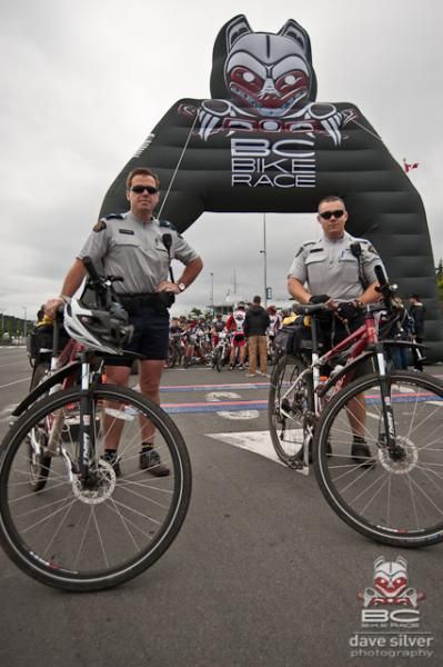 The men are keeping the order at the race.