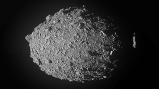 This high-resolution view of the asteroid Dimorphos was created by combining the final 10 full-frame images obtained by the NASA DART probe&#039;s Didymos Reconnaissance and Asteroid Camera for Optical navigation (DRACO) and layering the higher-resolution images on top of the lower-resolution ones. Dimorphos is oriented so that its north pole is toward the top of the image.