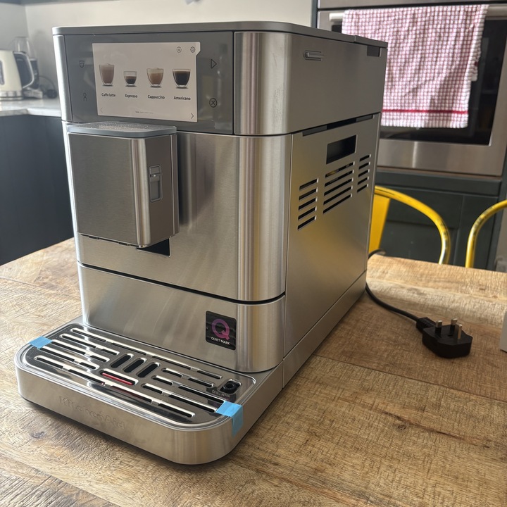 The newly unboxed KitchenAid Fully Automatic Espresso Machine KF8 with the protective stickers still attached.