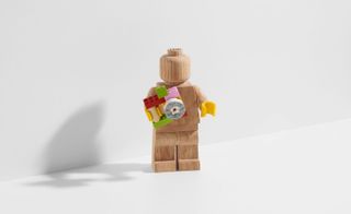 Lego minifigure holding a camera