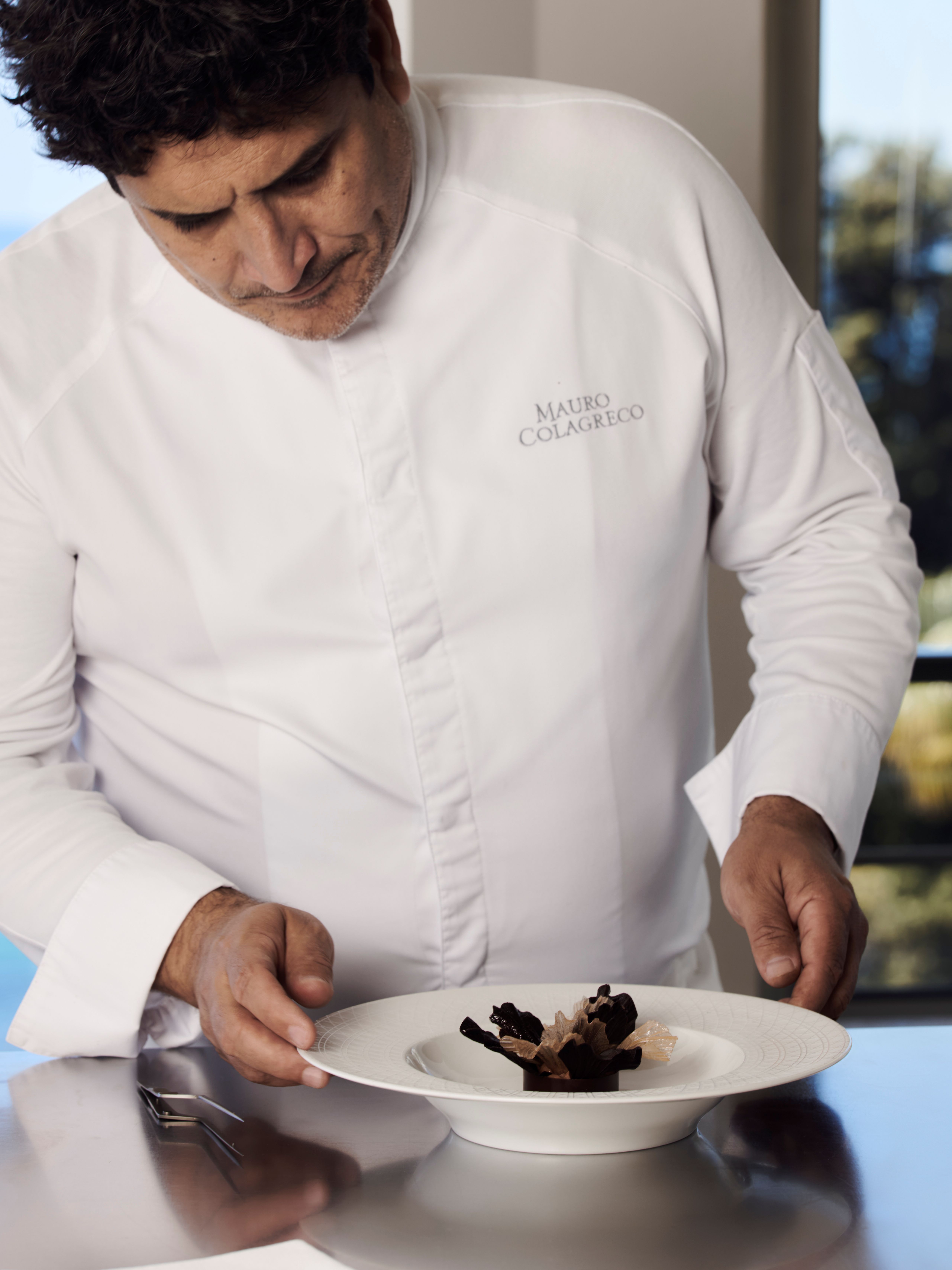 view of some of the dishes at monsieur dior restaurant by mauro colagreco