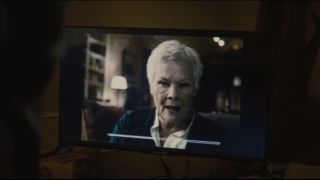 Dame Judi Dench speaking in a video in Spectre.