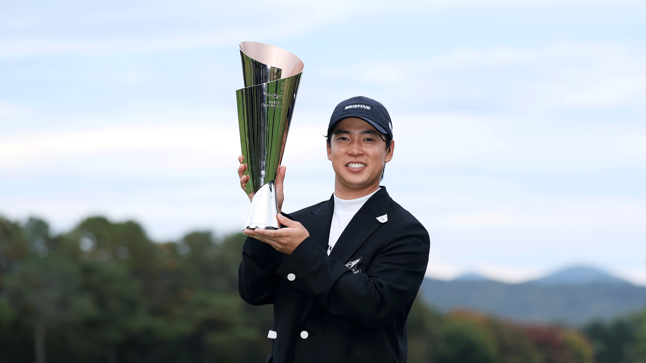 Yuto Katsuragawa poses with the Genesis Championship trophy after his win in 2026