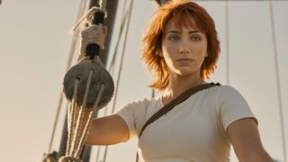 Emily Rudd as Nami on a boat in still from Netflix's One Piece