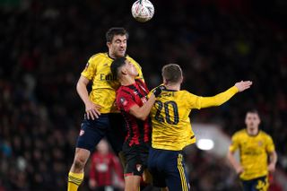 Arsenal’s Sokratis (left) and Shkodran Mustafi battle for the ball with Bournemouth’s Dominic Solanke during the FA Cup fourth round