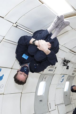 A passenger floats upside down aboard Zero-G's Aug. 16, 2020 flight.