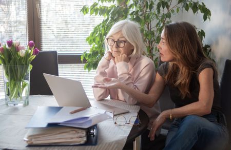A mother and adult daughter talk finances.