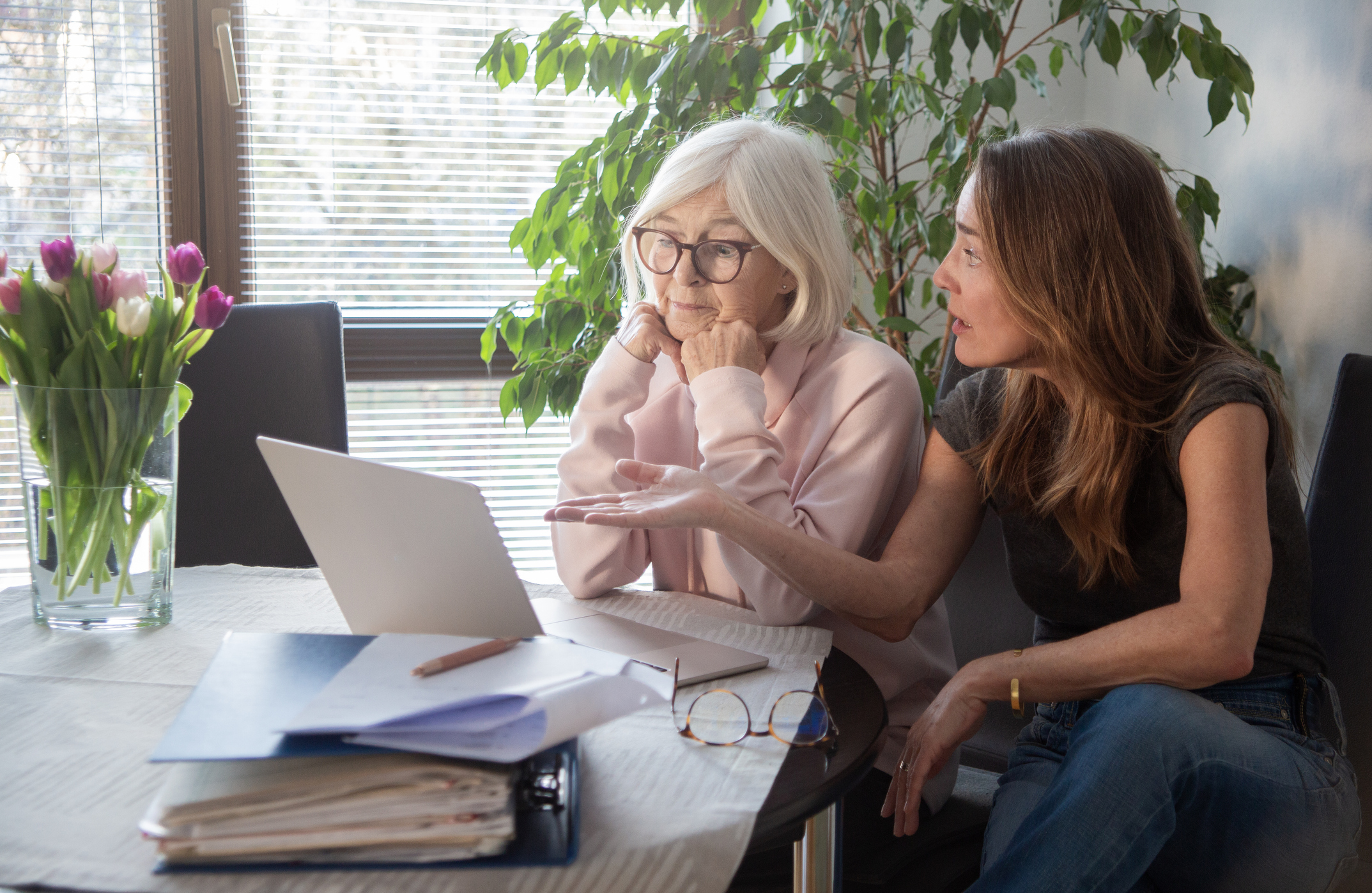 A mother and adult daughter talk finances.