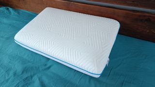 Luff Sleep The Mayfair Cooling Gel Pillow being tested and reviewed on a bed with a teal sheet