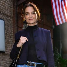 Katie Holmes attended a NYFW event in wide-leg jeans and a cropped jacket