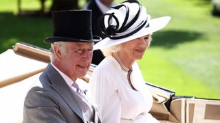 King Charles and Queen Camilla smile as they arrive on the fourth day of Royal Ascot