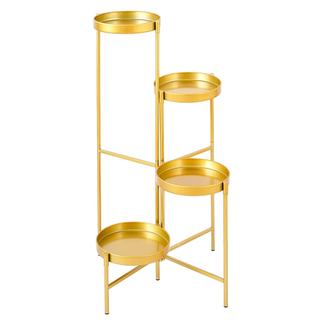 A gold metal 4-tier plant stand