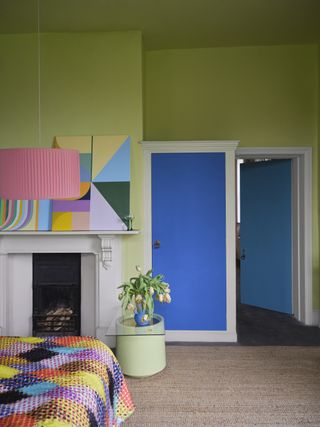bedroom with bright green walls and blue doors