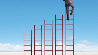 Red ladders staggered from shortest to tallest with man climbing tallest ladder