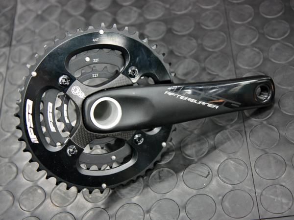 FSA's latest Afterburner mountain bike crankset retains the hollow-forged aluminum arms but adds a carbon fiber chainring spider.