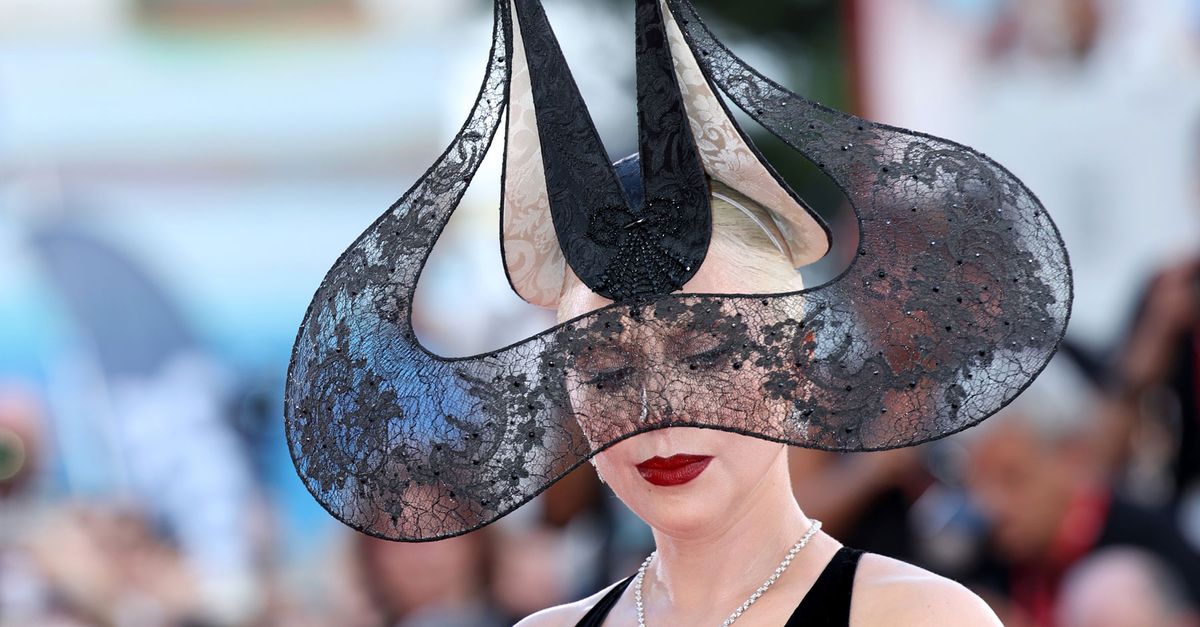 Girl Gaga Wore a Dramatic Lace Headpiece on the Purple Carpet