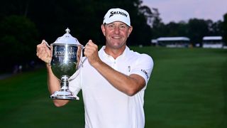 Lucas Glover with the Wyndham Championship trophy