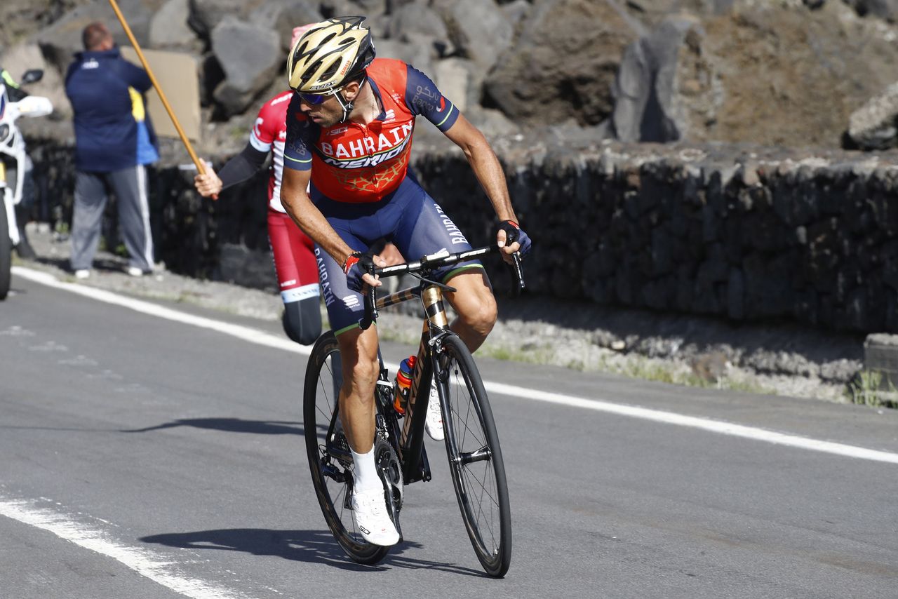 Vincenzo Nibali looks behind to see who is following him as he makes his way up Mount Etna