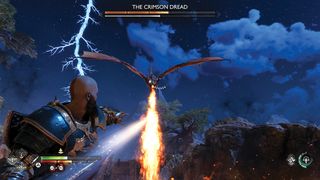 God Of War Ragnarok; a man fights a fire breathing dragon