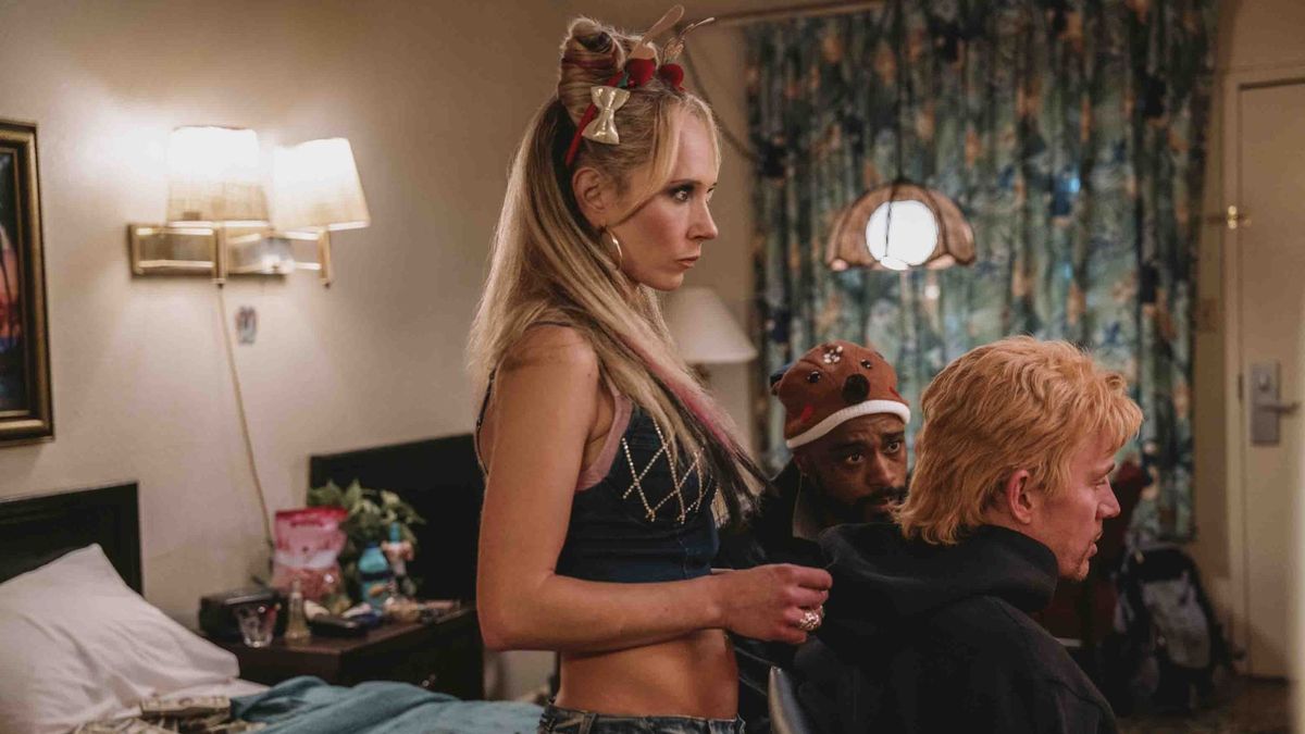 Juno Temple working on LaKeith Stanfield and Channing Tatum's hair in Roofman