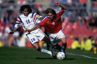 Czech Republic's Karel Poborsky up against France's Reynald Pedros at Euro 96.