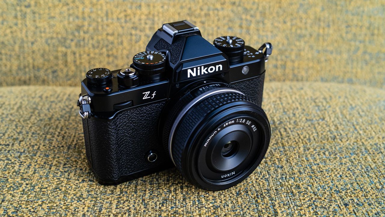 Nikon Z f camera on a vintage-style yellow chair