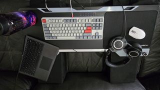 Couchmaster Cycon3 set-up on a sofa with a keyboard and mouse.