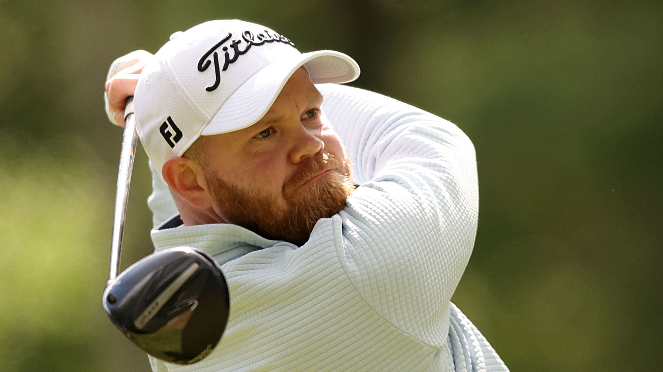 Golfer Nathan Kimsey hitting a drive