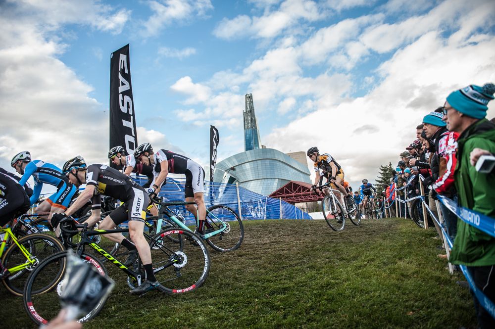 Elite men race over the Tetro Design knoll of pain in the shadow of the Human Rights Museum