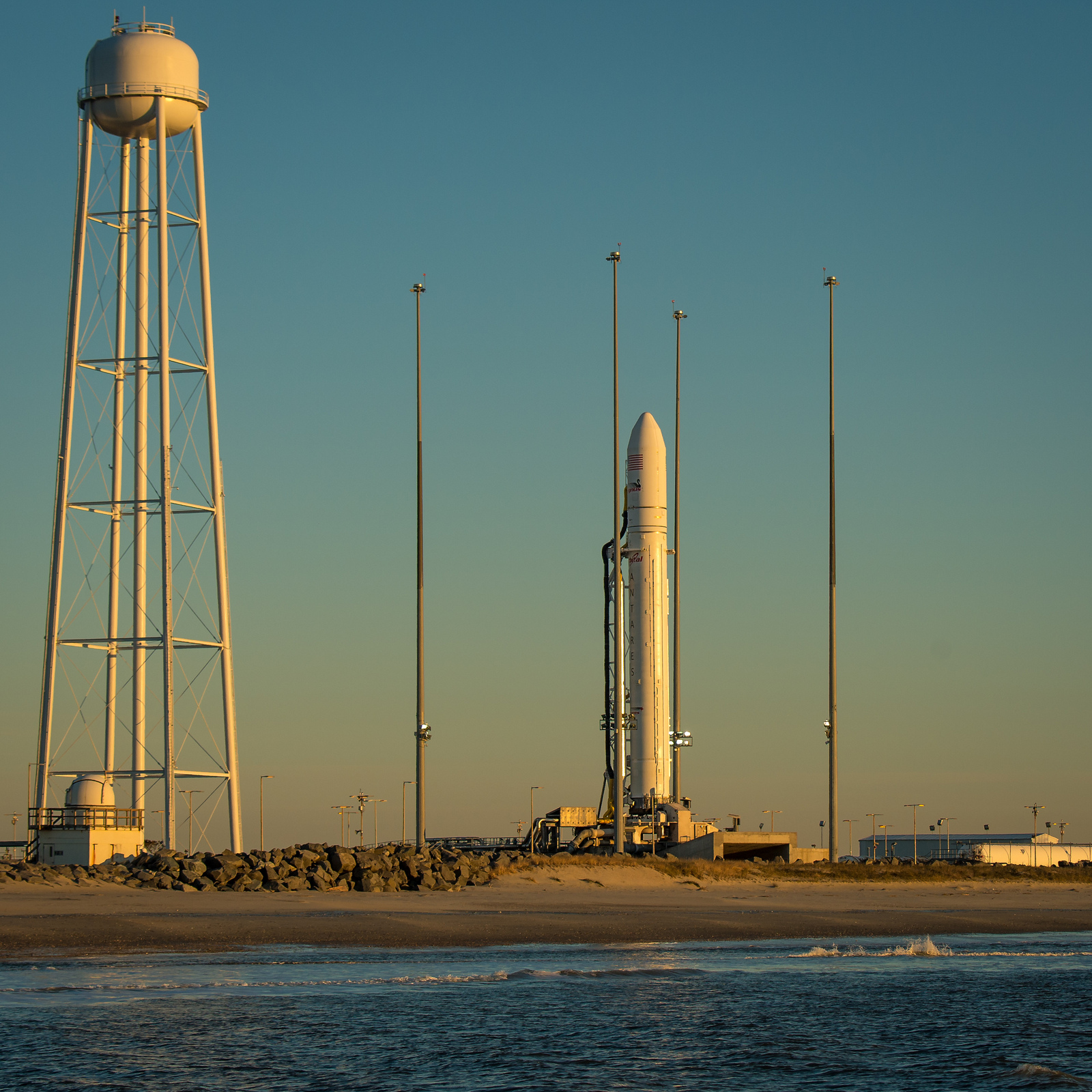 An Orbital Sciences Corporation Antares rocket is seen on launch Pad-0A during sunrise at NASA&#039;s Wallops Flight Facility on Wallops Island, Va., on Jan. 8, 2014 after its planned launch was delayed a day due to solar radiation concerns from a huge solar f