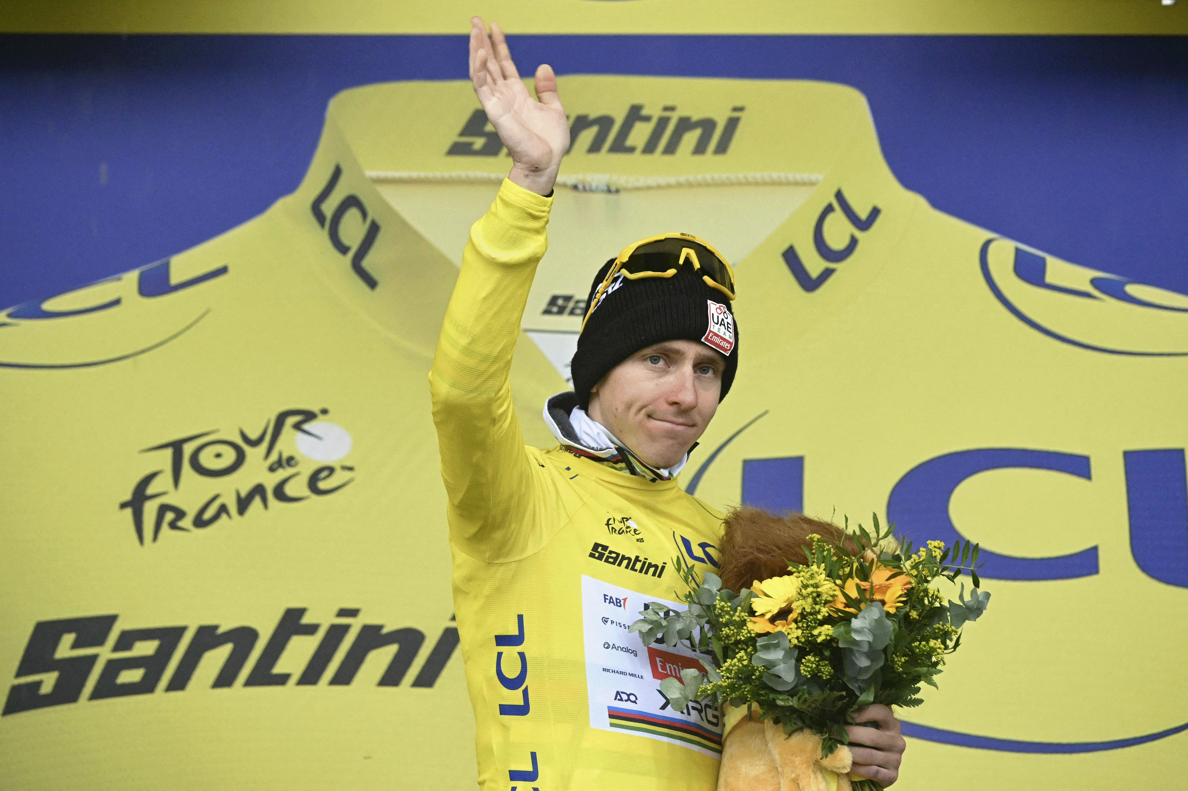 UAE Team Emirates - XRG team's Slovenian rider Tadej Pogacar celebrates on the podium with the overall leader's yellow jersey after the 17th stage of the 112th edition of the Tour de France cycling race, 160.4 km between Bollene and Valence, southern France, on July 23, 2025. (Photo by Loic VENANCE / AFP) (Photo by LOIC VENANCE/AFP via Getty Images)