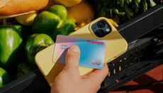 Picture of a Monzo Aura card on top of a smart phone