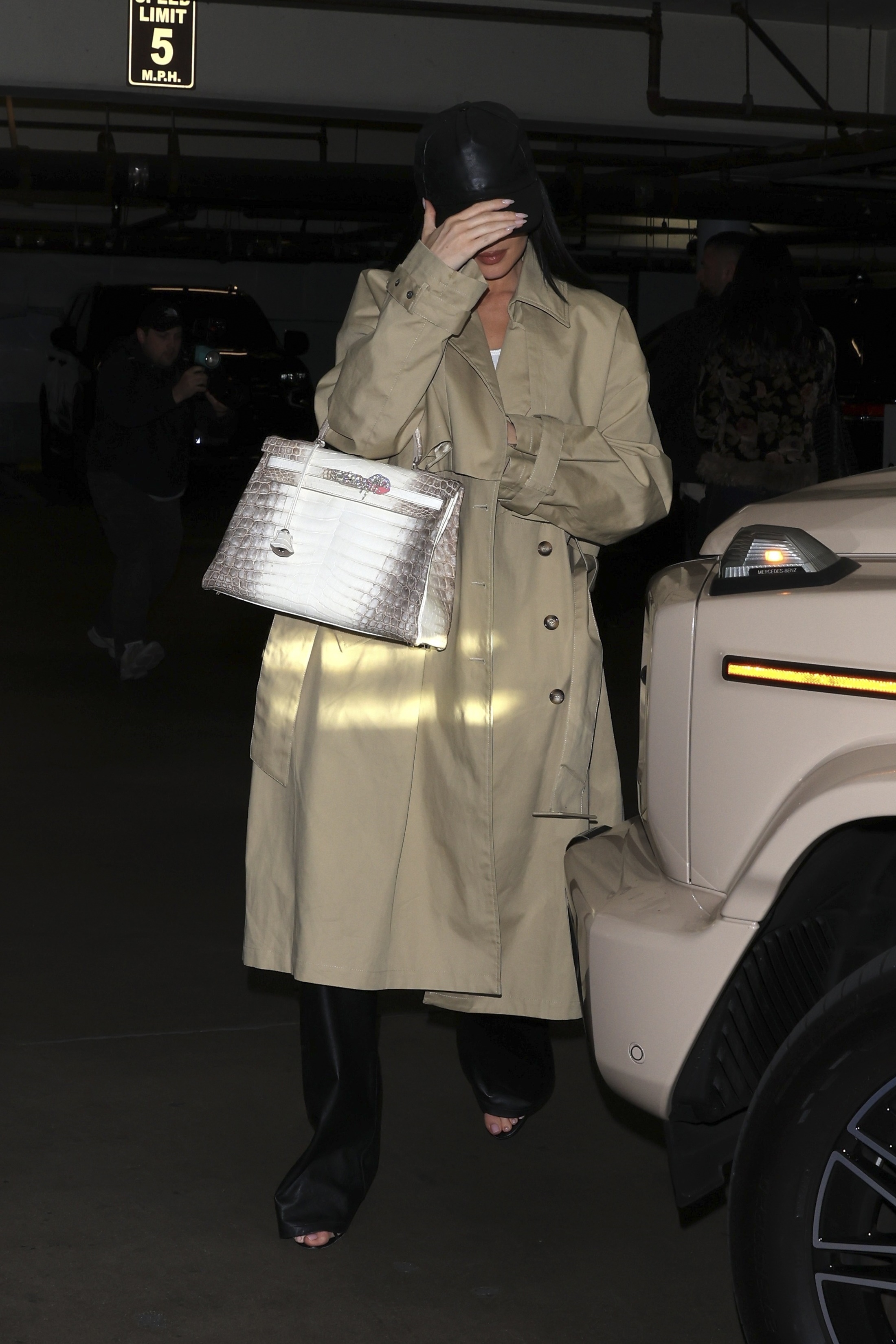 Kylie Jenner grabbed dinner with sister Kendall Jenner in a khaki trench coat and a rare Hermes Himalayan Birkin