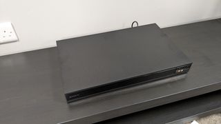 Sony UBP-X800M2 on dark stand 