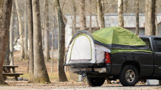 Pickup bed camping tent in campground